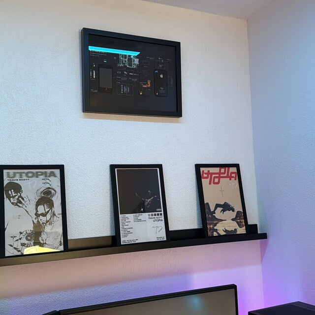 Customer photo of a framed tech product on a wall.